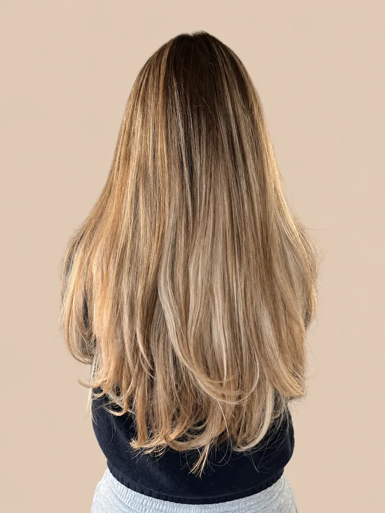 noticeably fuller hair to mid-back with blonde highlights
