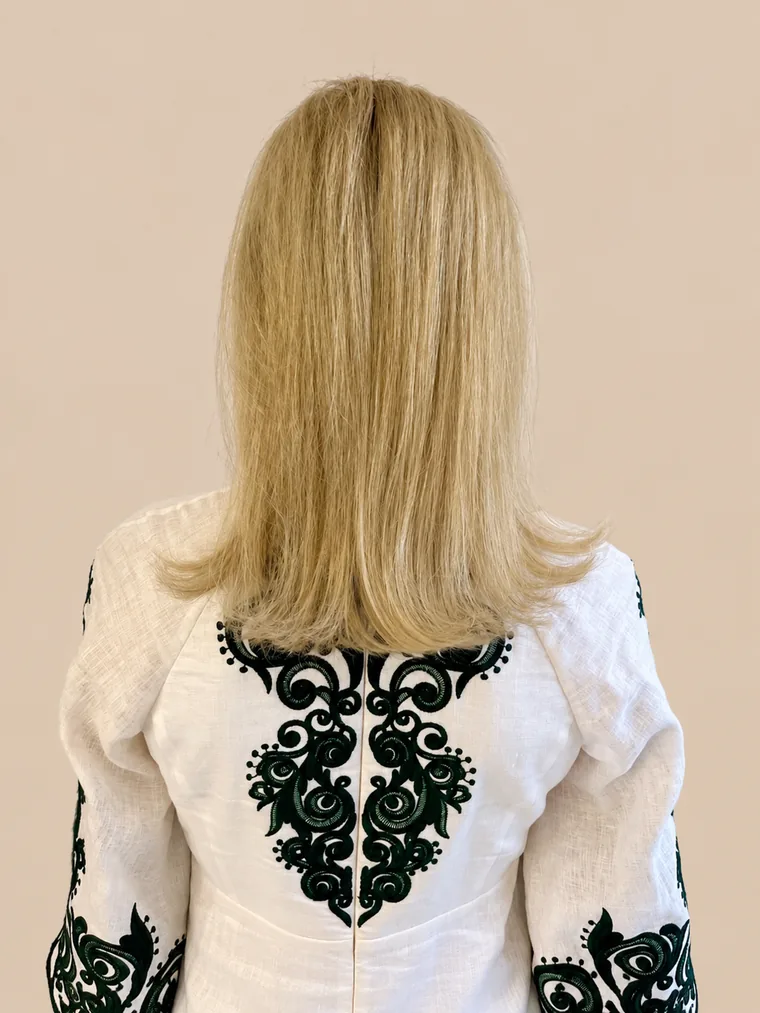 shoulder-length, straight blonde hair with little volume